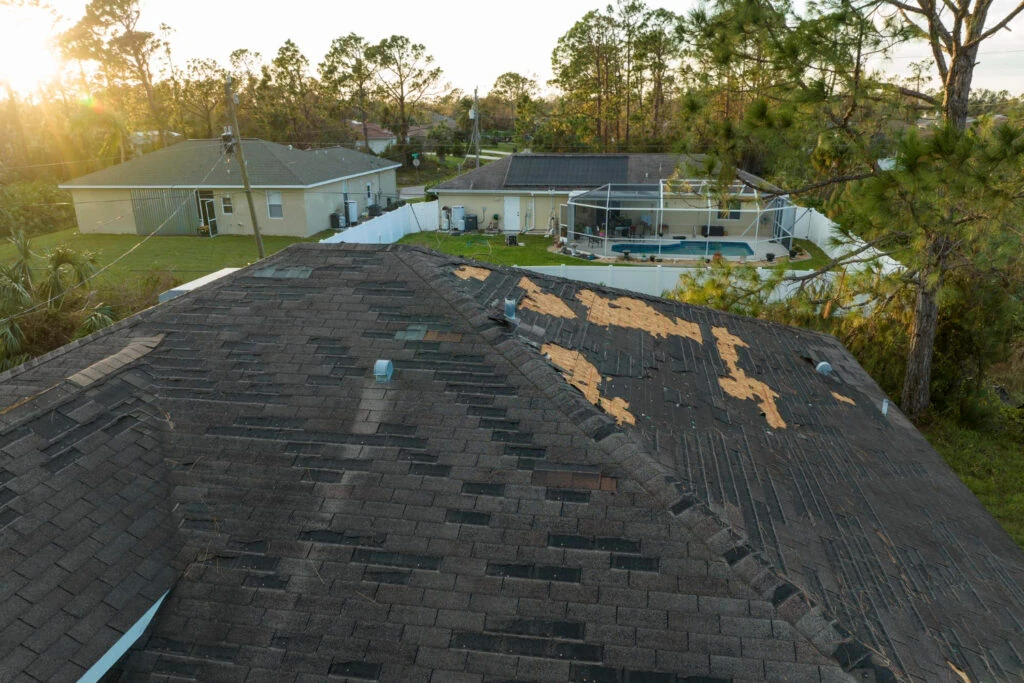 roof damaged by storm call roofing contractor